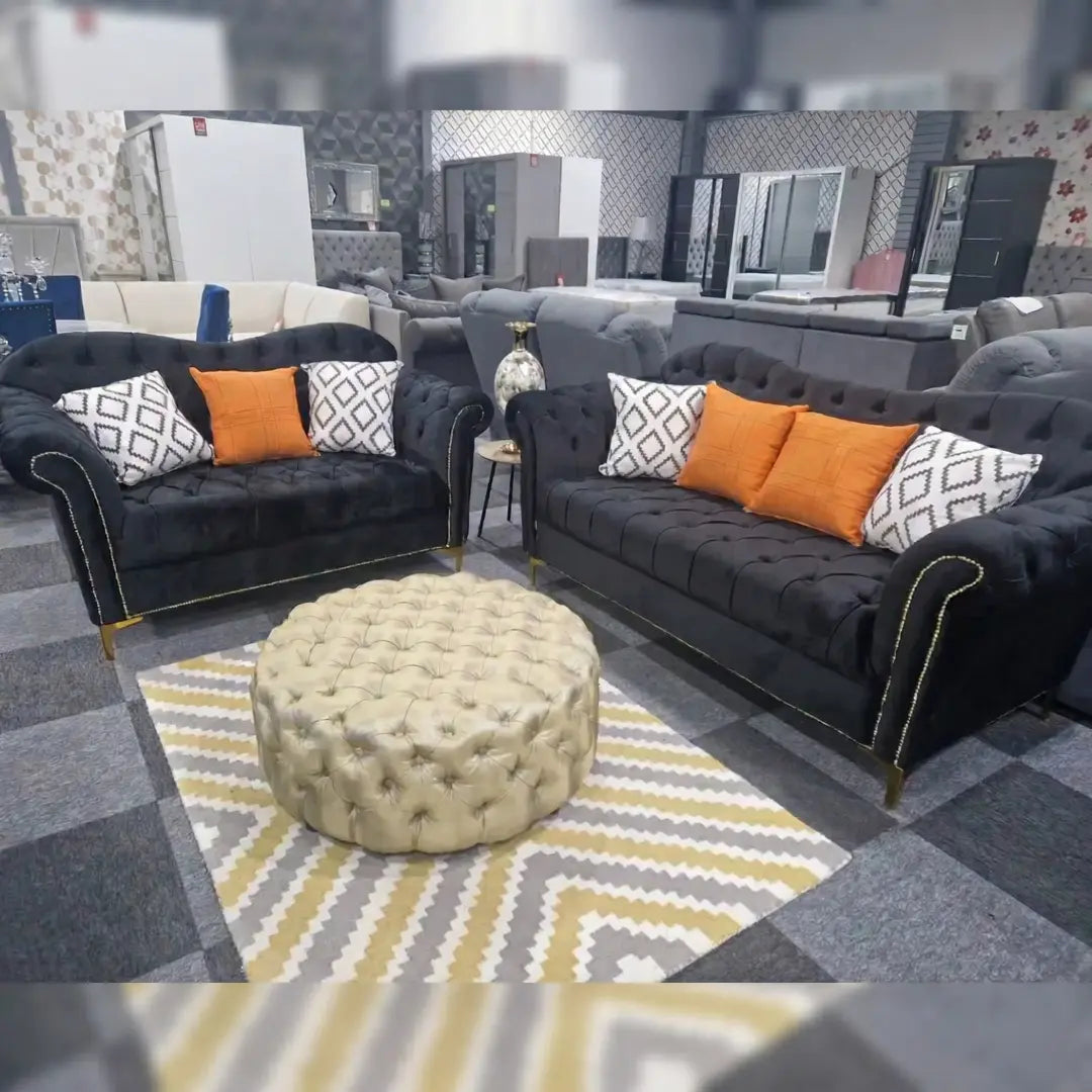 Black Elegance Chesterfield Sofa 3+2 from, showcasing plush upholstery and classic tufted design.