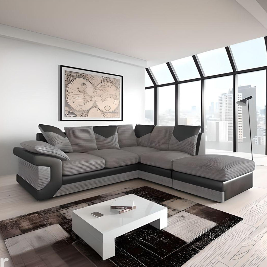 Large grey corner sofa LARGE-DINO-CORNER-SOFA-GREY-BLACK-LEFT-HAND-SIDE-FOAM. Fire resistant as per British Standards, foam filled seats for comfort.