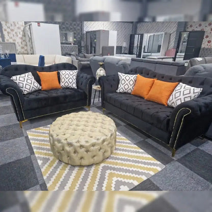 Black Elegance Chesterfield Sofa 3+2 from, showcasing plush upholstery and classic tufted design.